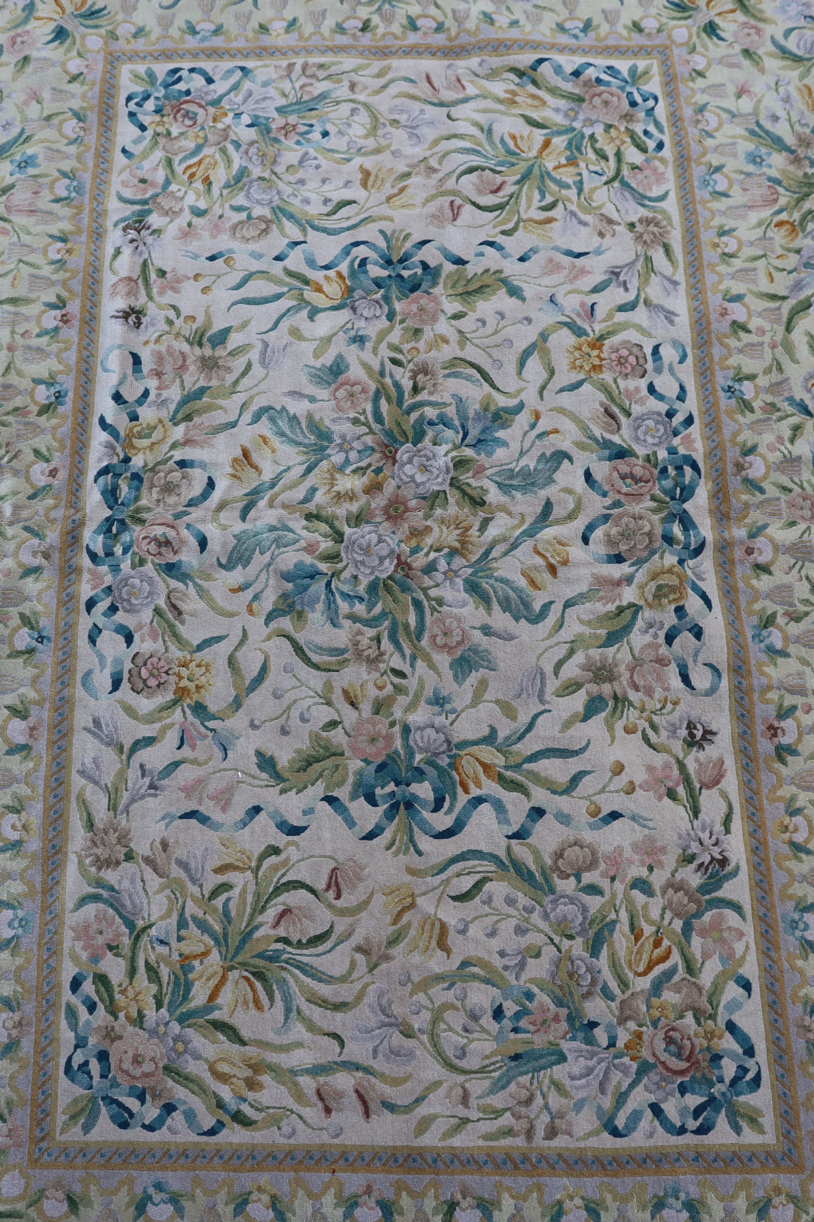 An Aubusson style ivory ground carpet, 372 x 274cm.